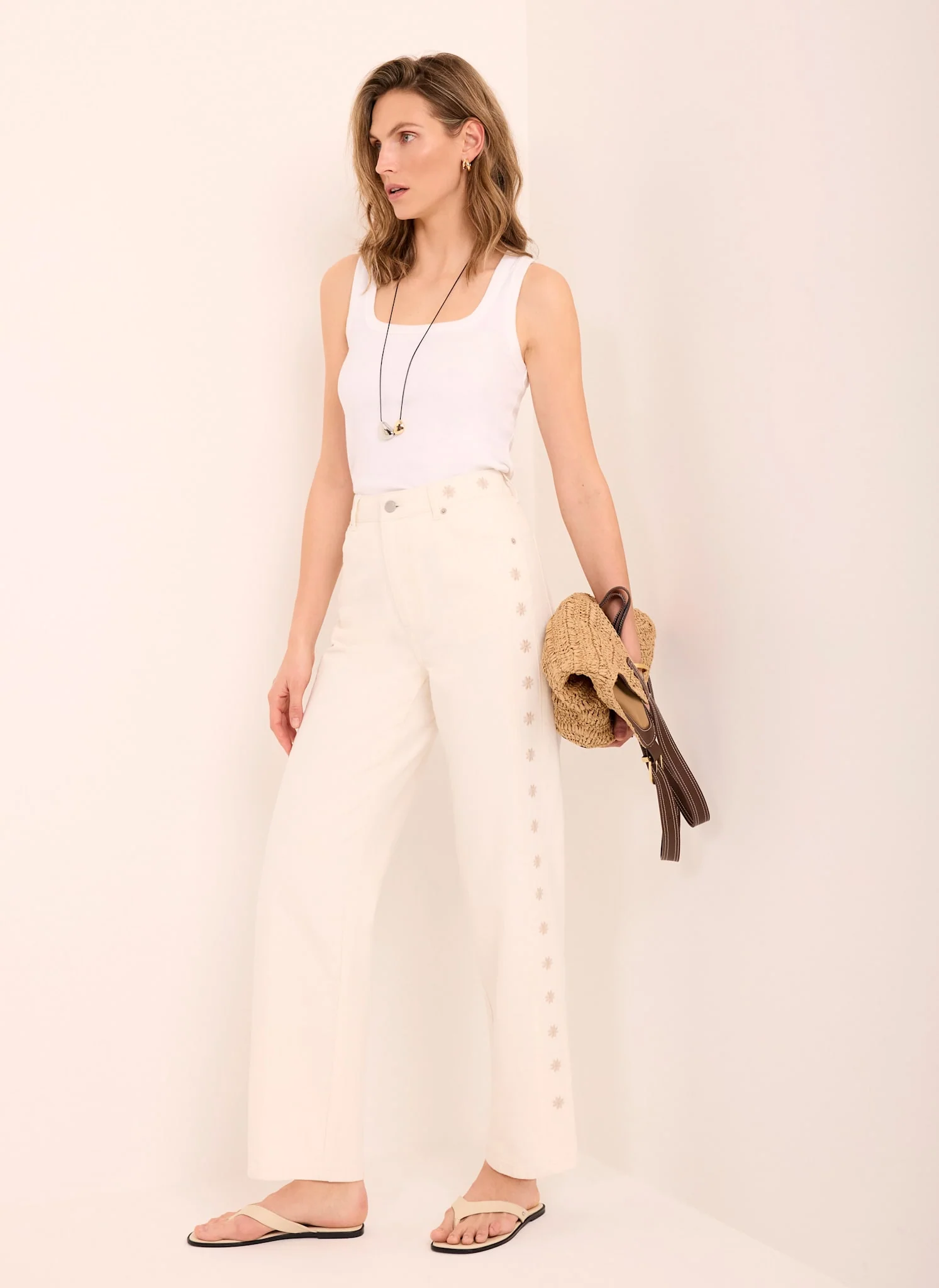 4510-cream-floral-embroidered-tapered-jeans-1.webp Cream Floral Embroidered Tapered Jeans