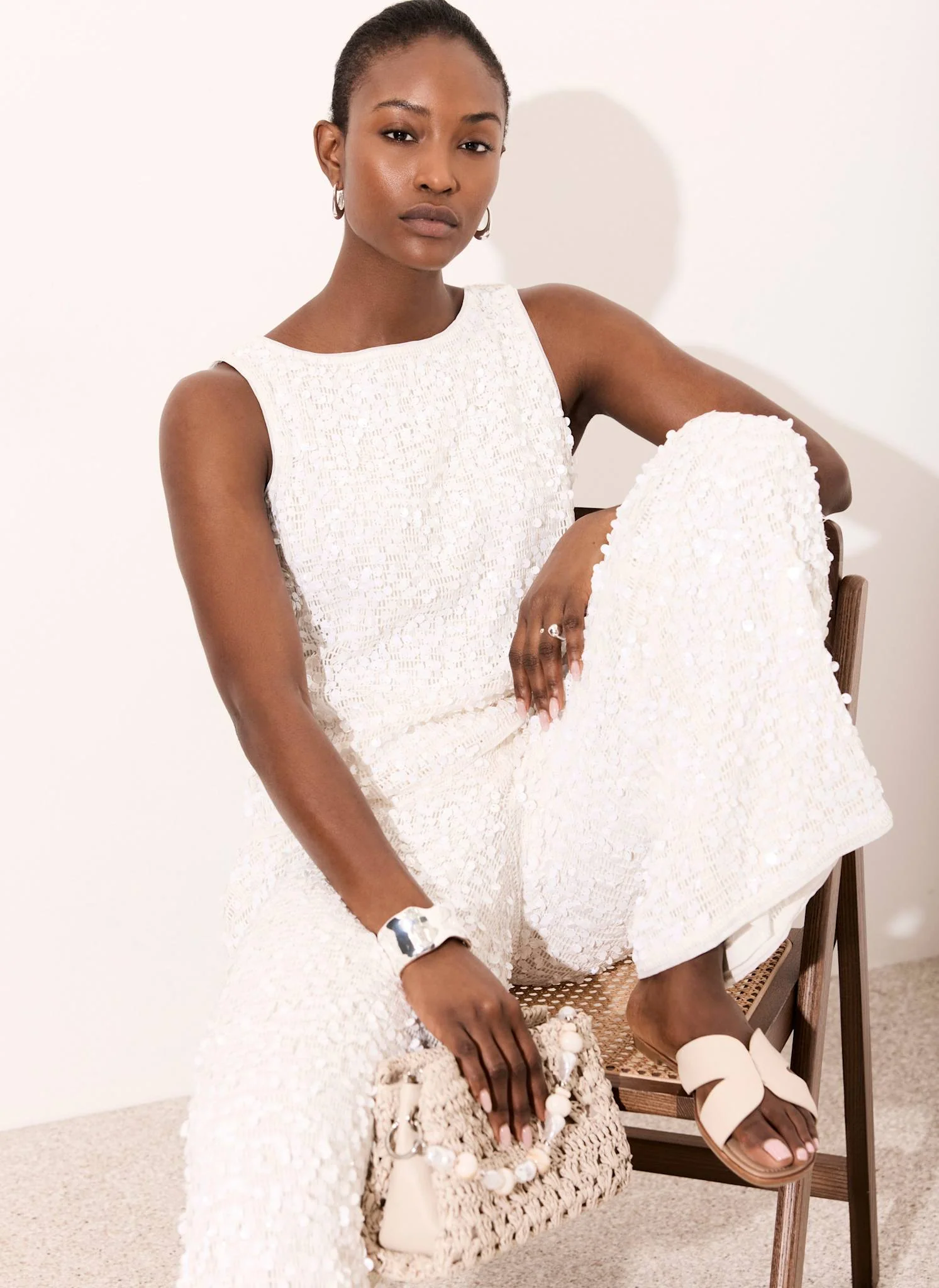 8696-white-sequin-sleeveless-top-1.webp White Sequin Sleeveless Top
